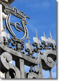 detail of the gate spire with the ancient armorial bearings of the city