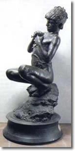 Young fisherman in custom sitting on a rock