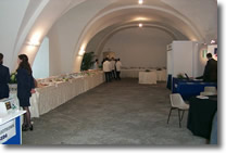 picture of the hall with laid tables and waiters